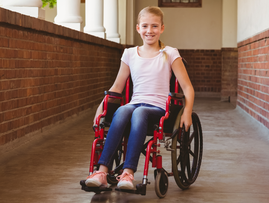 Young girl in red wheelchair